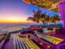 Luxurious rooftop terrace with infinity pool and panoramic city view at sunset