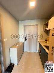 Compact building entrance area with shoe rack and kitchenette