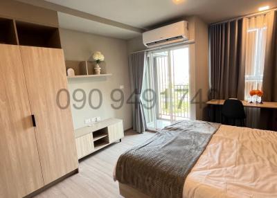 Contemporary bedroom with natural light and modern furniture