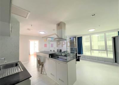 Modern kitchen with stainless steel appliances and open layout