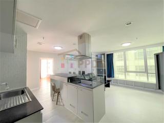 Modern kitchen with stainless steel appliances and open layout