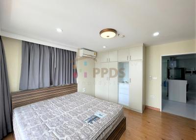 Spacious bedroom with large bed and modern amenities