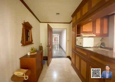 Spacious kitchen with wooden cabinets and modern appliances