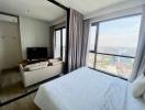 Modern bedroom with large window providing city views