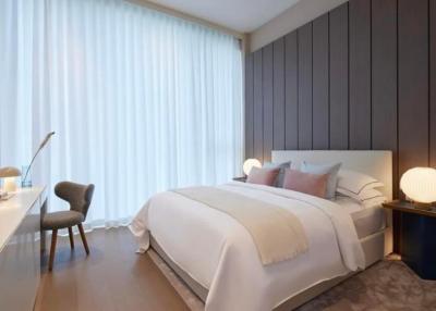 Modern bedroom interior with a neatly made bed, ambient lighting and elegant decor