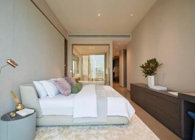 Modern spacious bedroom with king-size bed, en-suite bathroom access, and elegant decor