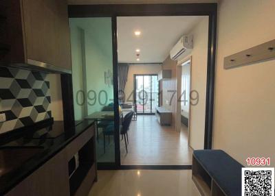 Modern apartment interior view showing kitchen and living area