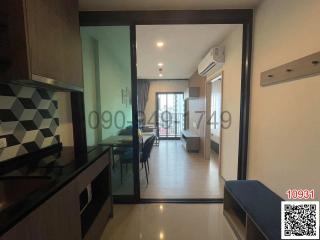 Modern apartment interior view showing kitchen and living area