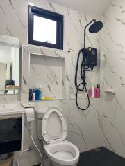 Modern bathroom interior with marble tiles and shower