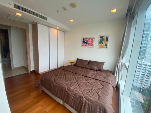 Cozy bedroom with a large bed and modern art on the wall