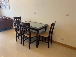 Modern dining area with wooden table and chairs