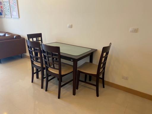 Modern dining area with wooden table and chairs