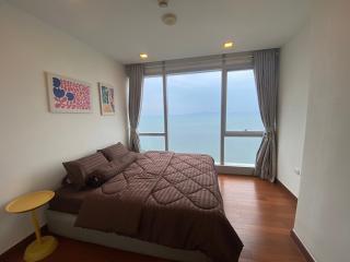 Cozy bedroom with ocean view and ample natural light