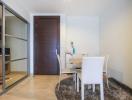 Modern dining area with sliding door and wooden flooring