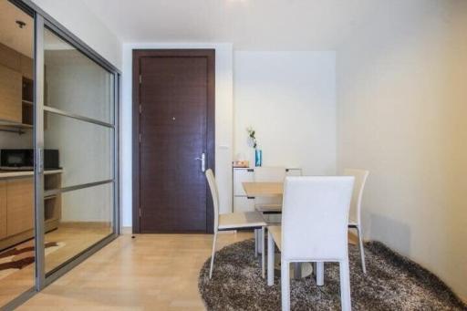 Modern dining area with sliding door and wooden flooring