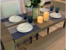 Elegantly set dining table with modern decor