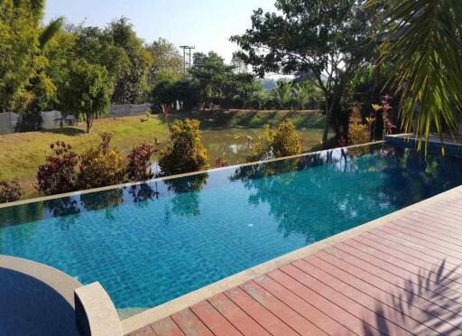Explore Chiang Mai real estate options with this Resort for sale - 14 rai of tranquility, 9 houses, a large pool, and proximity to top attractions. Hurry!