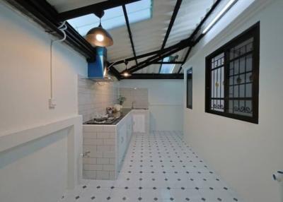 Modern kitchen with white subway tiles and patterned floor