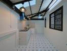Modern kitchen with white subway tiles and patterned floor