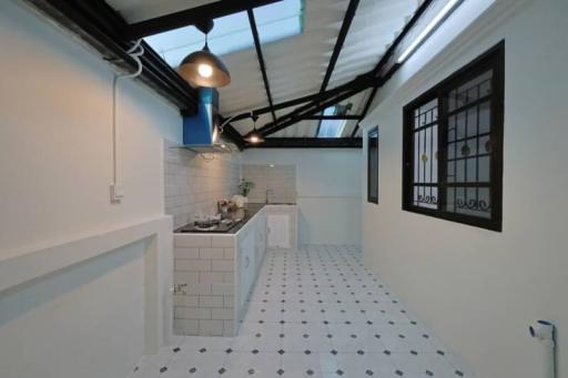 Modern kitchen with white subway tiles and patterned floor