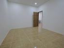 Spacious and bright unfurnished room with tiled flooring