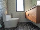 Modern bathroom with patterned tiles and wooden vanity