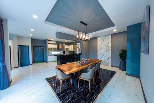 Elegant dining space with adjacent modern kitchen in contemporary home