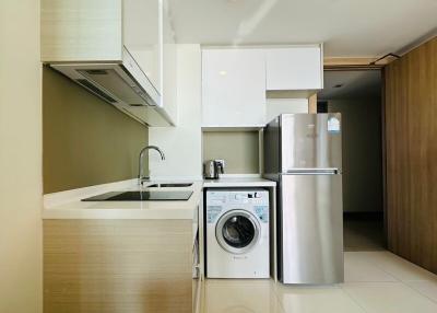 Modern kitchen with stainless steel appliances and white cabinetry