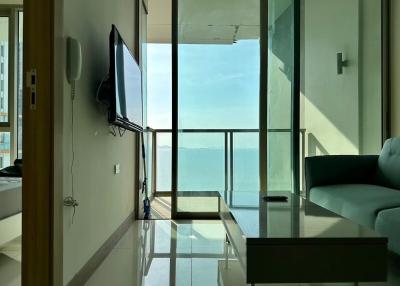 Modern living room with large windows and ocean view