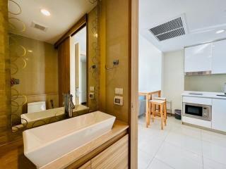 Modern bathroom with adjacent kitchenette