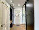 Modern hallway interior with wooden flooring and white doors