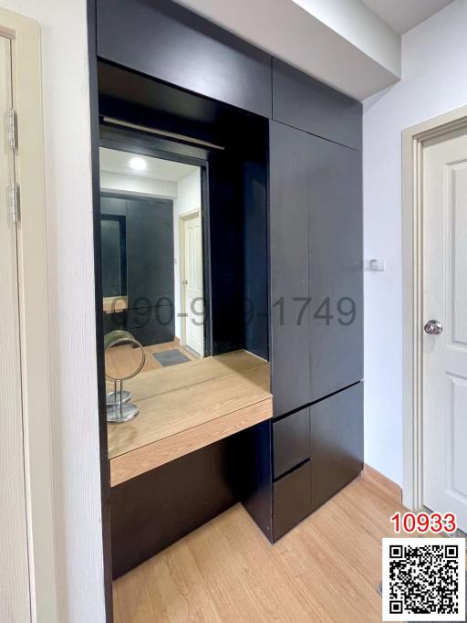 Compact bedroom with built-in wardrobe and vanity