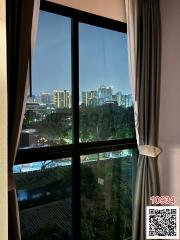 View from the bedroom window at dusk showcasing the city skyline