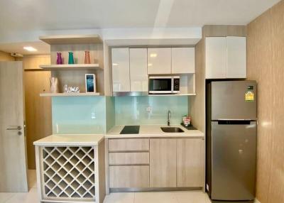 Modern kitchen with wooden cabinets and stainless steel appliances