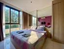 Bright and modern bedroom with large windows and colorful decor