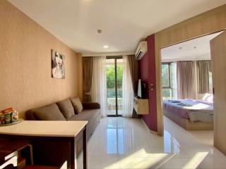 Bright and Well-furnished Studio Apartment Interior with Open Plan Living Area and Bedroom