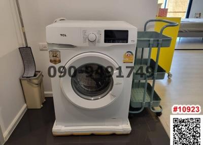 Modern washing machine in a utility space with tiled flooring