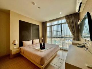 Modern bedroom with a large bed and panoramic window