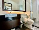 Modern bathroom interior with large mirror and glass shower cubicle