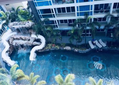 Luxury apartment complex with tropical pool and waterfall