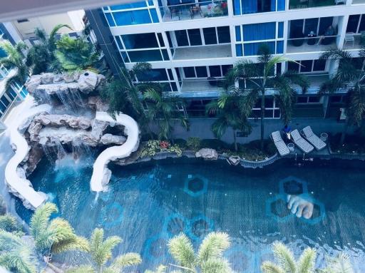 Luxury apartment complex with tropical pool and waterfall