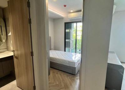 Modern bedroom with en suite bathroom and hardwood floors