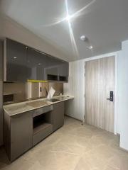 Modern kitchen with integrated appliances and wooden finishes