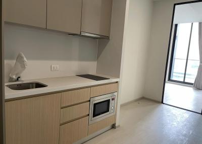 Modern kitchen with wooden cabinets and built-in appliances