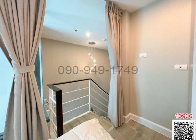 Cozy bedroom with elegant drapery and modern lighting