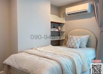 Cozy bedroom interior with queen-sized bed and air conditioning