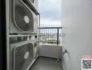 Balcony space with air conditioning units overlooking the city