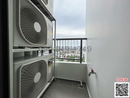 Balcony space with air conditioning units overlooking the city