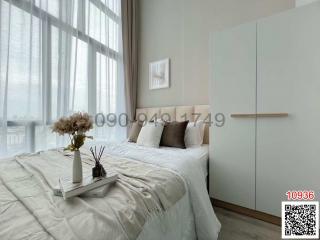 Modern bedroom interior with large window and minimalist décor