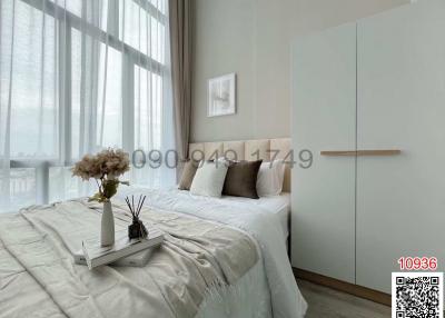 Modern bedroom interior with large window and minimalist décor